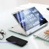 Hands typing at a desk in front of a tablet showing marketing analytics dashboards, featured image from Best Digital Marketing Agencies in Singapore