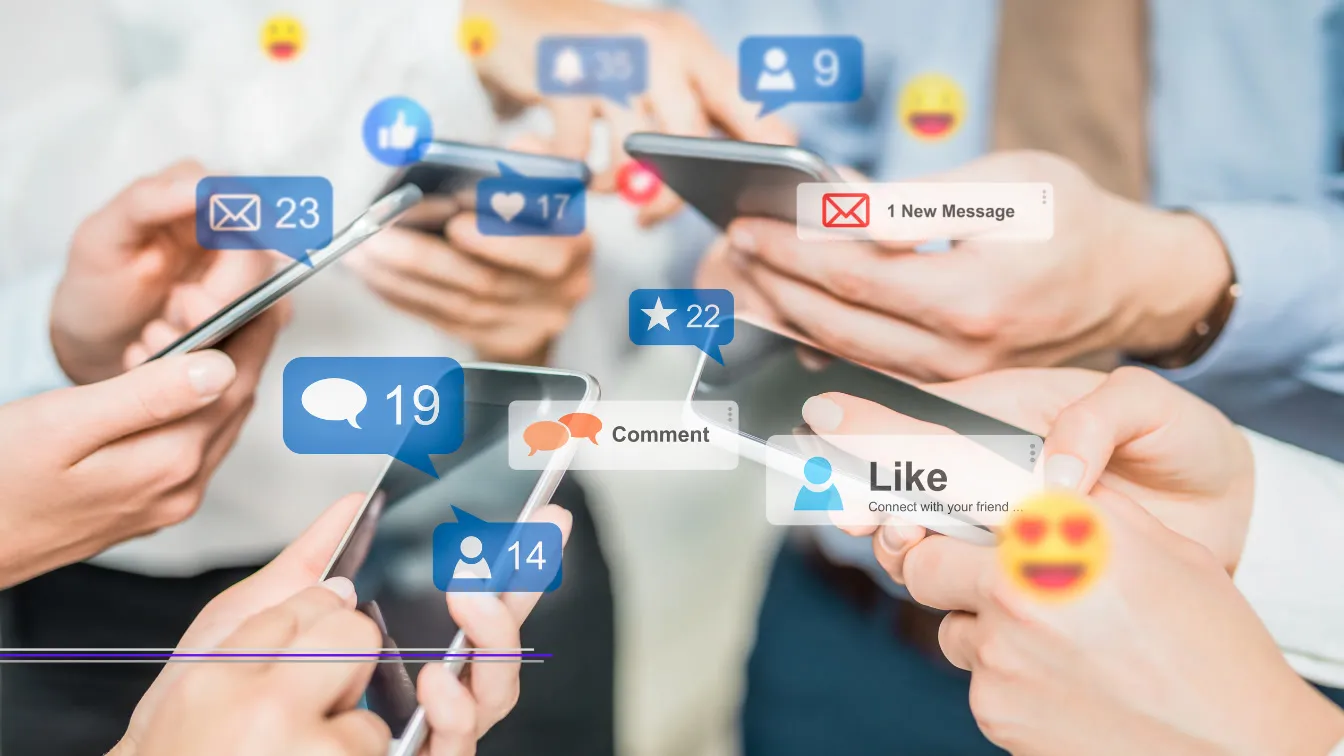 People holding smartphones with like, comment, and message overlays, featured image from Best Social Media Agencies in Singapore